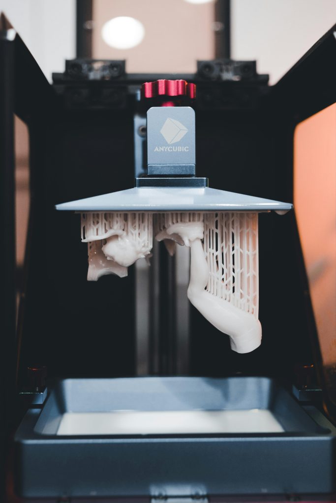 pexels-photo-12268465-12268465 High-quality close-up of a 3D printer printing an object with resin.